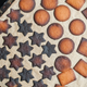 burnt holiday cookies on a parchment-lined baking sheet